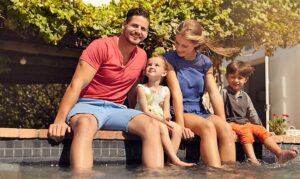 bigstock Beautiful Young Family Sitting 95133425